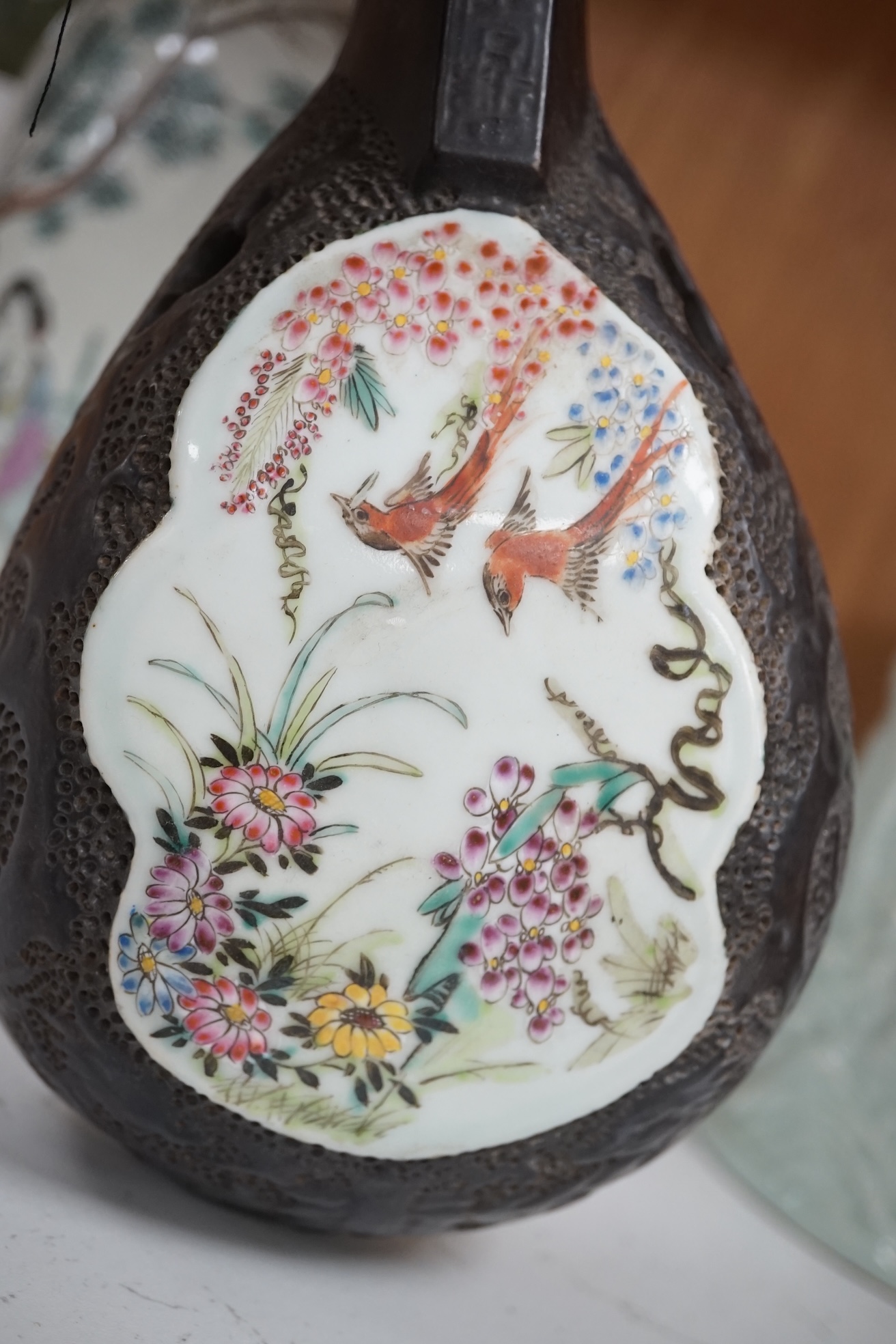 Three Chinese items comprising model of a stringed instrument (Pipa?), a celadon glazed brush pot and famille rose jar and cover, Republic period, 25cm high. Condition- fair to good